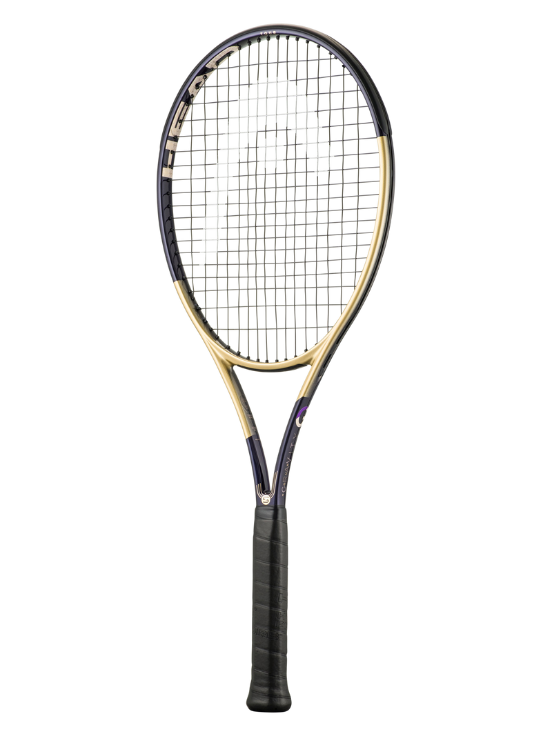 A tennis racket with a black and gold frame, black strings, and a black grip, shown vertically against a plain white background.